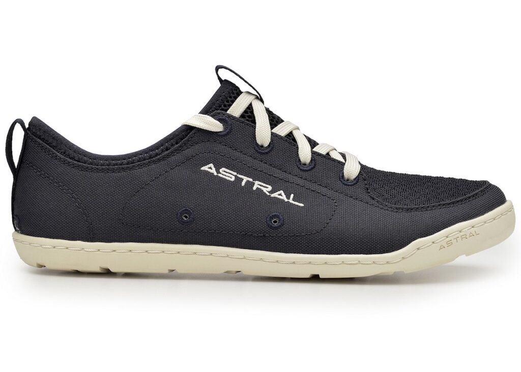 A close up side view of a single navy blue Astral Loyak water shoe with a white background