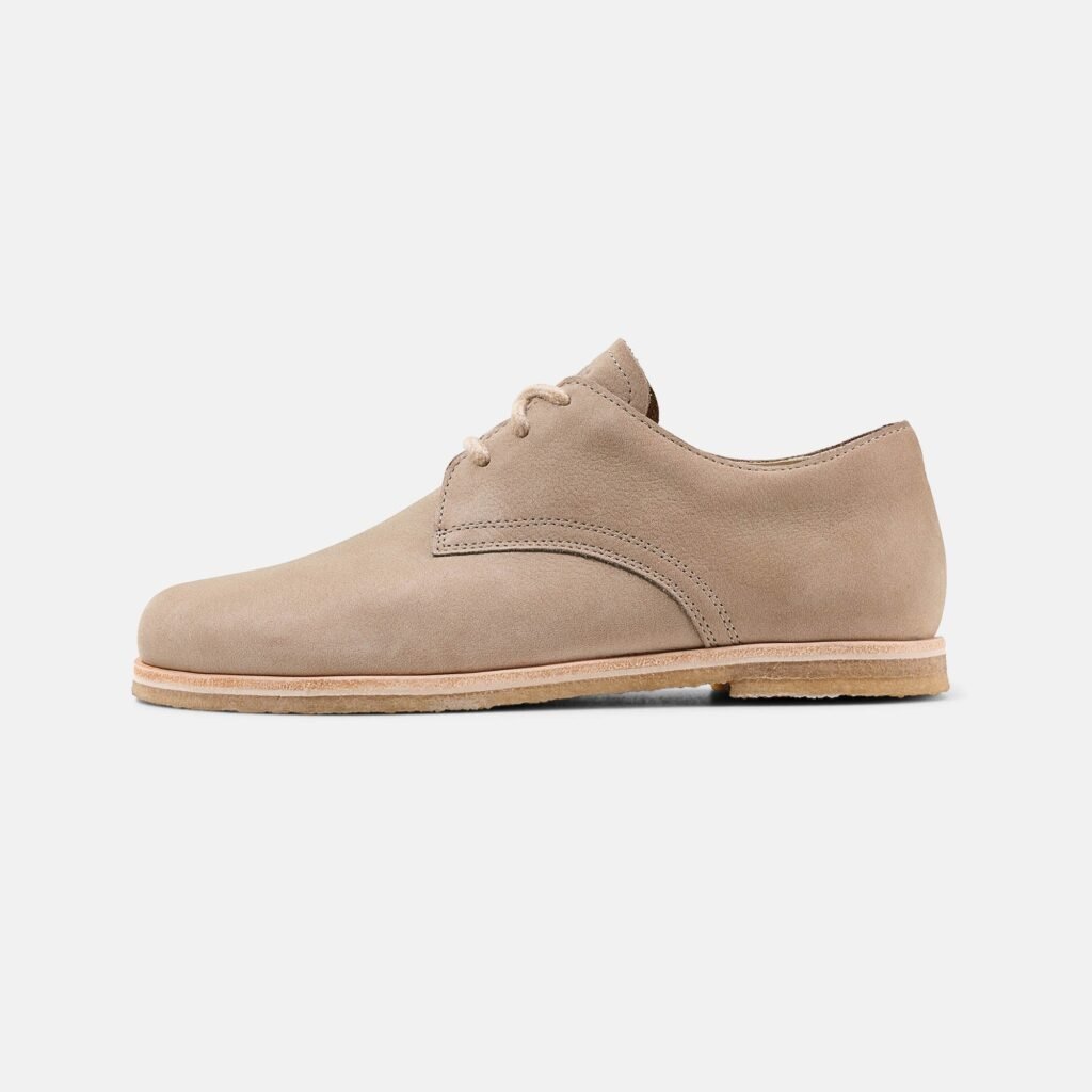 Stock image of a pair of Men's barefoot dress shoes with a wide toe box and small heel.
