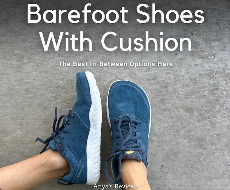 A close up view of a pair of feet resting on concrete wearing Lems Barefoot shoes Primal Zen suede in blue with the text "barefoot shoes with cushion, the best in-between options here, Anya's Reviews"