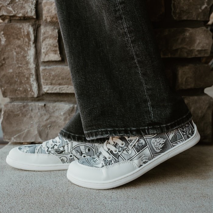 A close up side view of a pair of feet wearing the new Be Lenka Comics Rebound barefoot sneakers