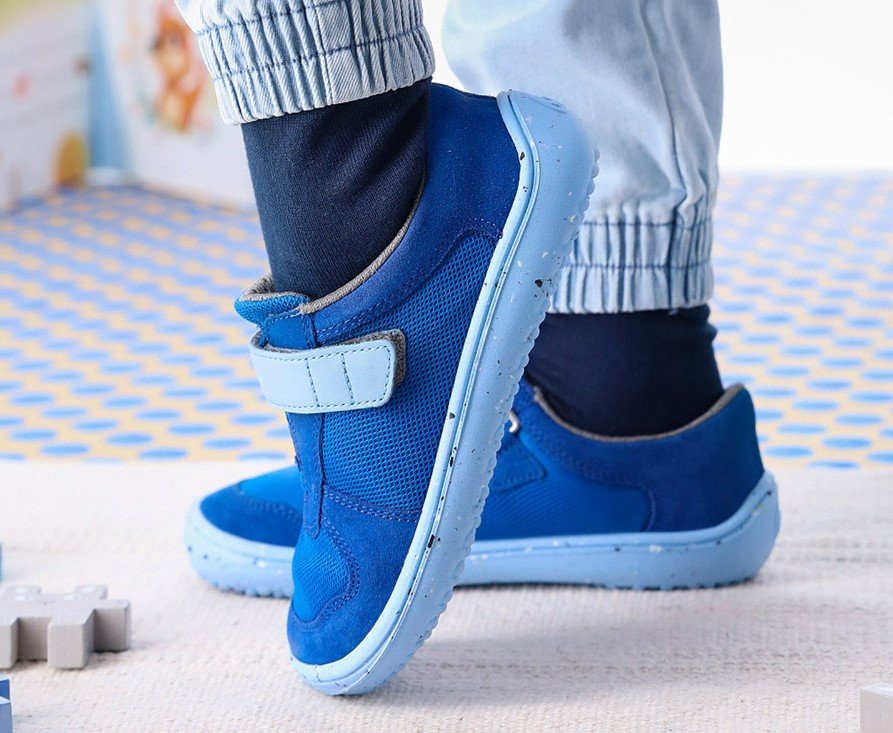 Side profile view of Be Lenka Joy blue barefoot flexible sneakers for extra wide feet