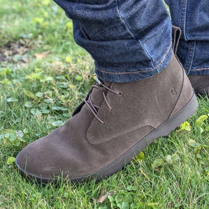 Side slightly flexed view of Birchbury Carnforth wide toe box chukka boot in brown suede with a faux heel