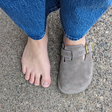 Top down photo of a person with extra wide feet wearing 1 Butterfly Your World barefoot clog and the other foot bare to show the shape match