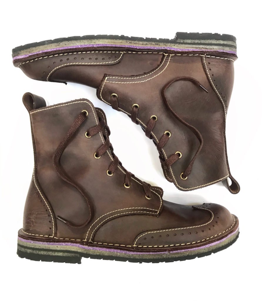 Conker Shoes stock image of a pair of detailed handmade leather boots laying on their sides