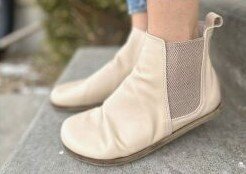 Aintap Feelbarefoot Etsy handmade turkish chelsea boots in pretty cream leather front angled flexed view