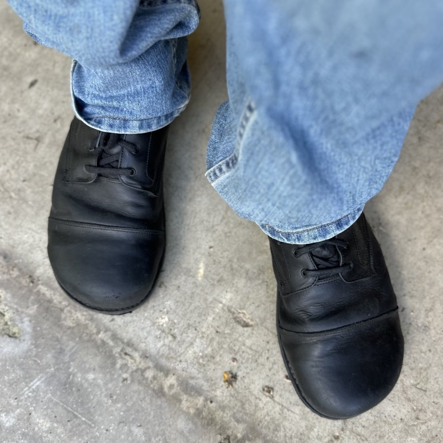 Top down view of a person standing in Gaucho Ninja Steel toe extra wide toe box leather boots with traditional goodyear welted construction