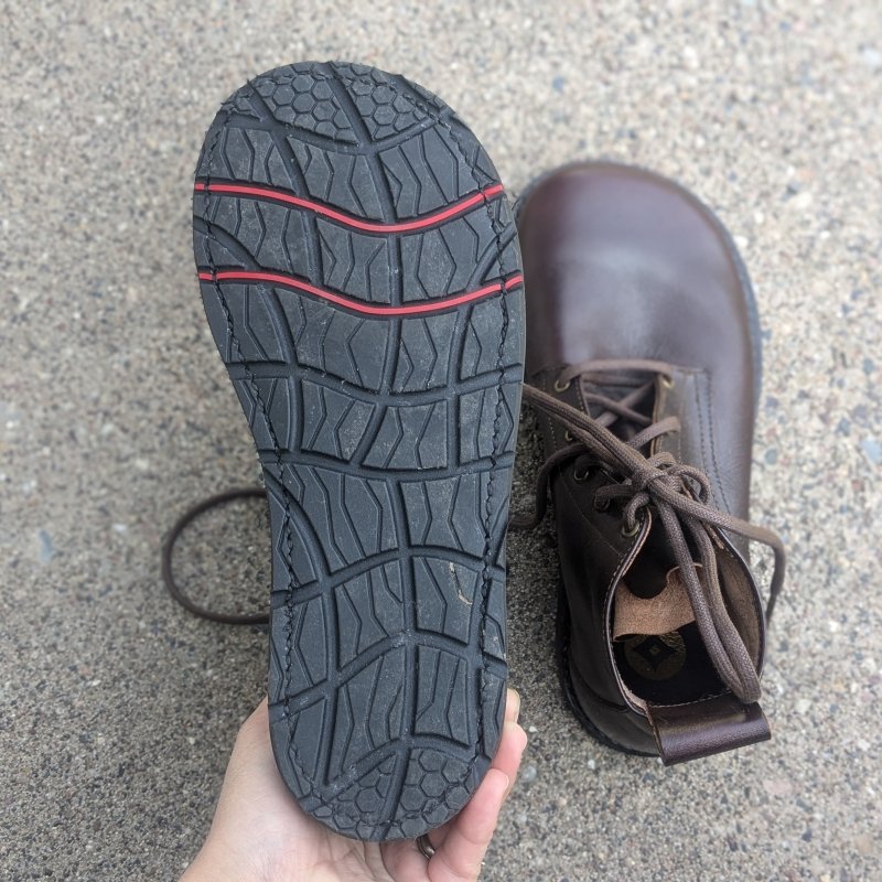 Gaucho Ninja goodyear welted barefoot wide toe box outsole shown from the bottom. The other boot is visible in the background.