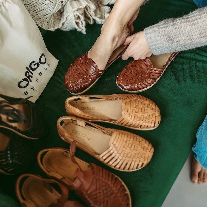 A row of beautiful woven barefoot dress shoes for women in a tradition Mexican huarache style, called the Origo Huarache by Anya