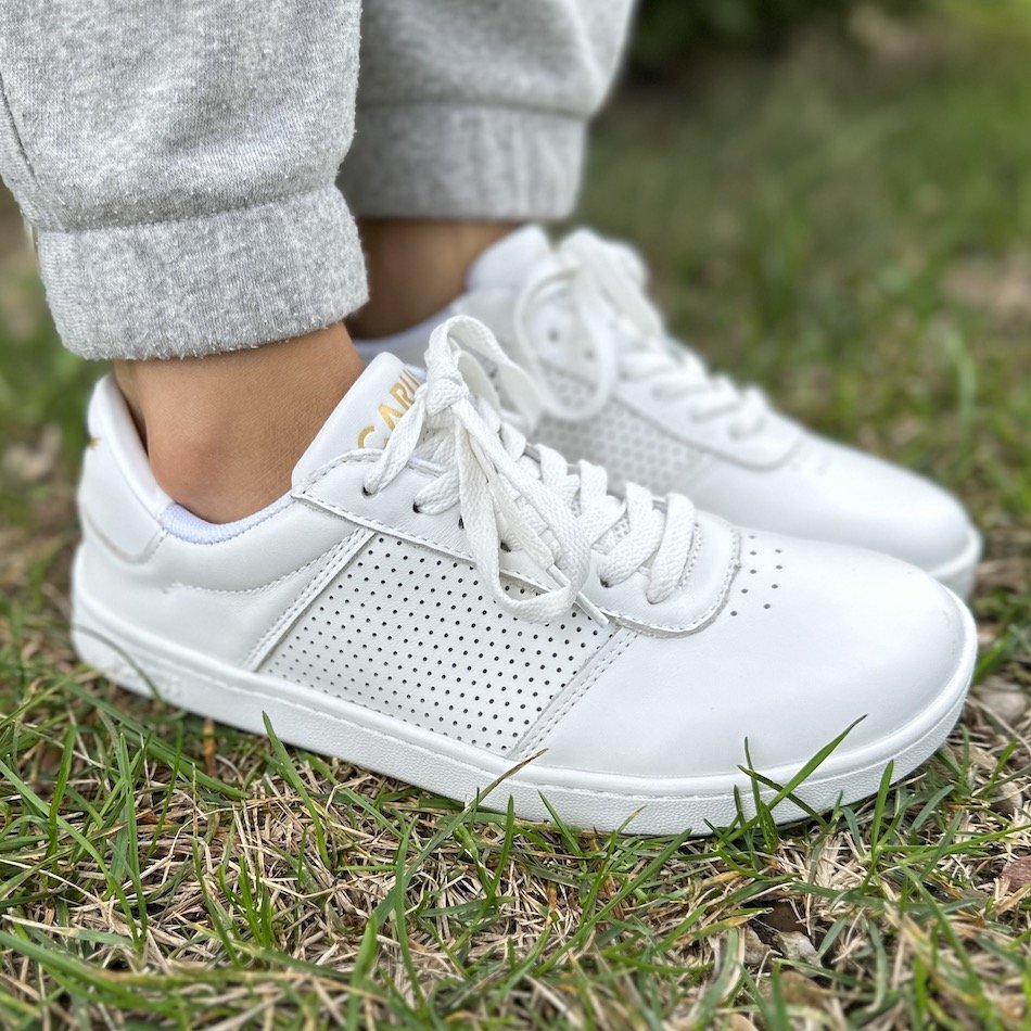 Side angled view of Icarus transition footwear with a wide toe box and optional supportive insoles