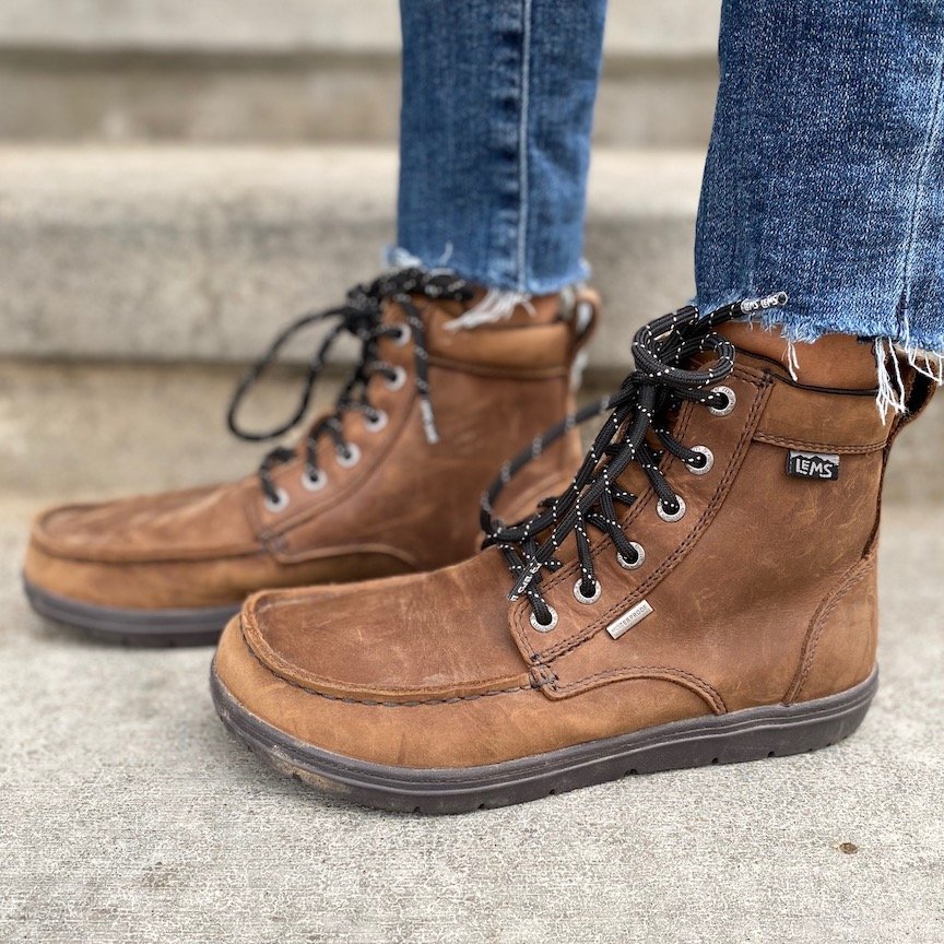 a close up of a pair of feet wearing the Lem's Waterproof Boulder Boot