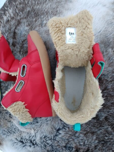 Red high top sneakers from Ten Little opened up to show the faur fur lining