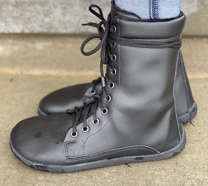 Side view of a pair of feet wearing Ahinsa Jaya Black Vegan Barefoot Combat Boots