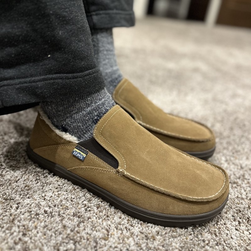 Side view of indoor outdoors Lems Drifter Fur convertible back barefoot friendly slippers
