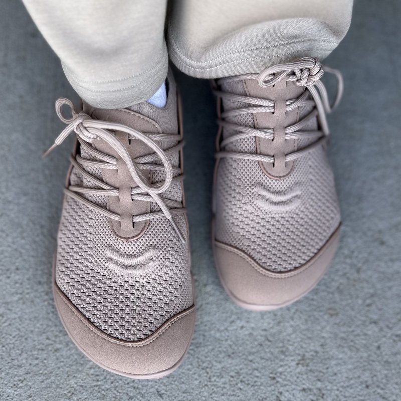 A pair of taupe Lono Flow anatomical toe box sneakers in a biodegradable knit material