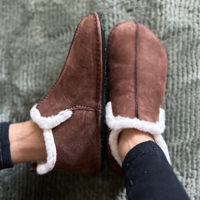 Top down and side profile view of Luks Barefoot leather slippers with a rubber outsole for extra wide feet