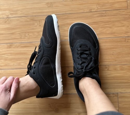 Minnemals black sneakers top down and side view worn