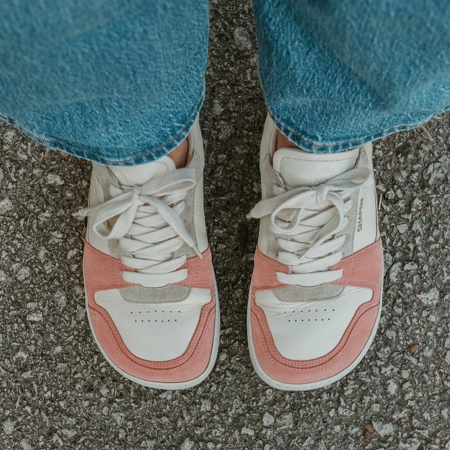 A close up top down view of Shapen Rewind soft leather comfortable sneakers with a wide toe box in white leather and peach suede
