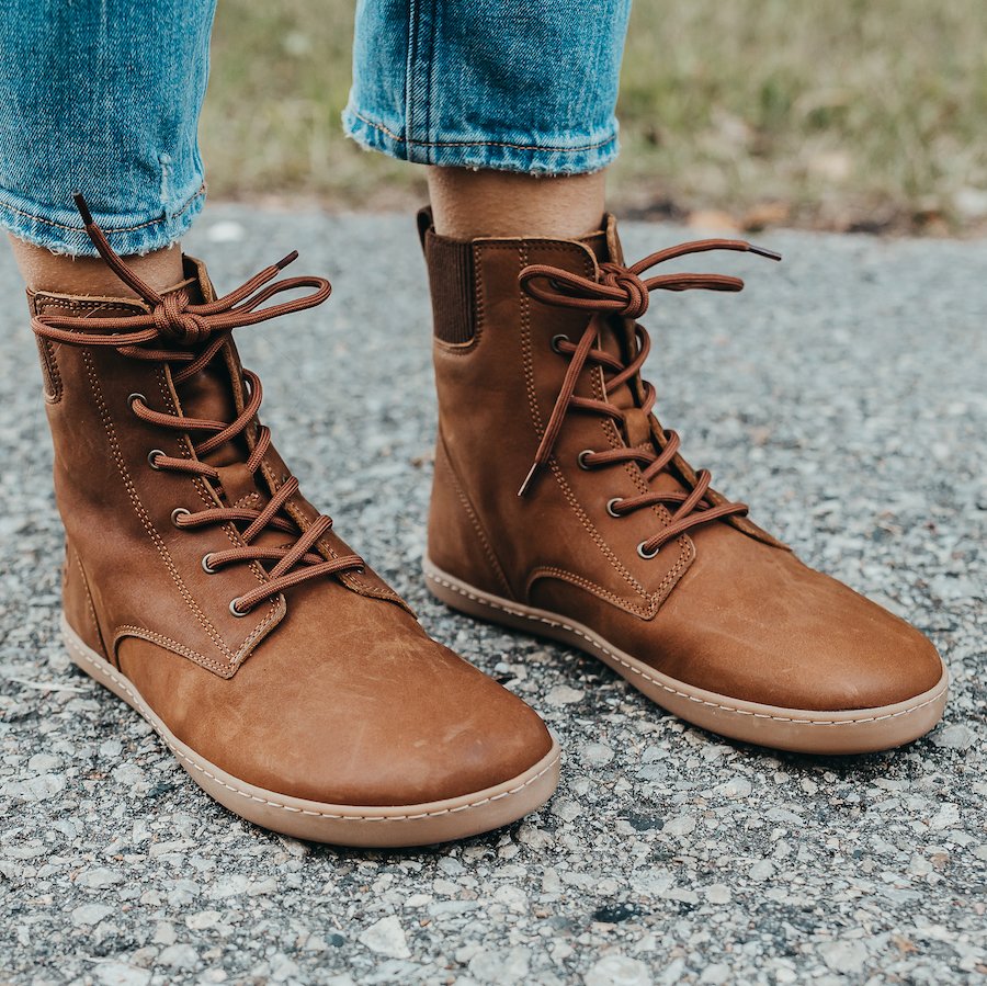 Front angled close up of Shapen Barefoot Urbaneer barefoot winter boots with super flexible zero drop outside and extra wide toe box. The brown leather is a pretty mid-tone with matching laces.