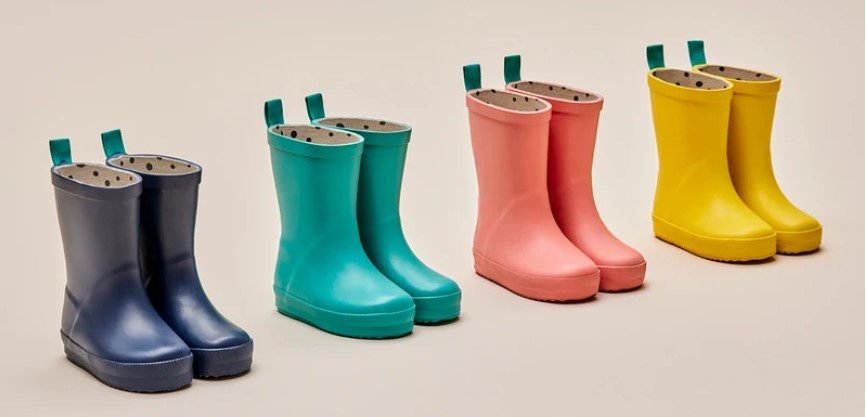Stock image of Ten Little affordable rain boots in navy, teal, orange, and yellow.