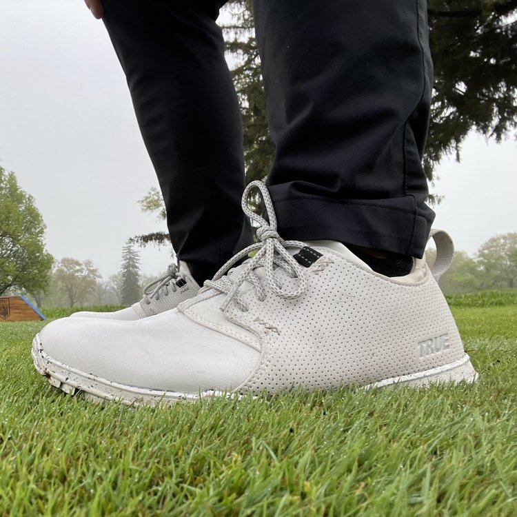 Close up side view of True Linkswear Golf Shoes Original design worn with grass in the foreground