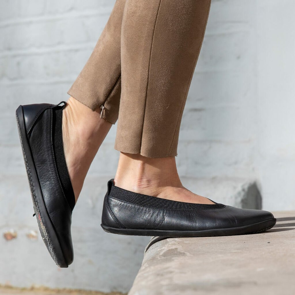 Stock image of Vivobarefoot Opank ballet flat in black leather with anatomical wide toe box and zero drop sole