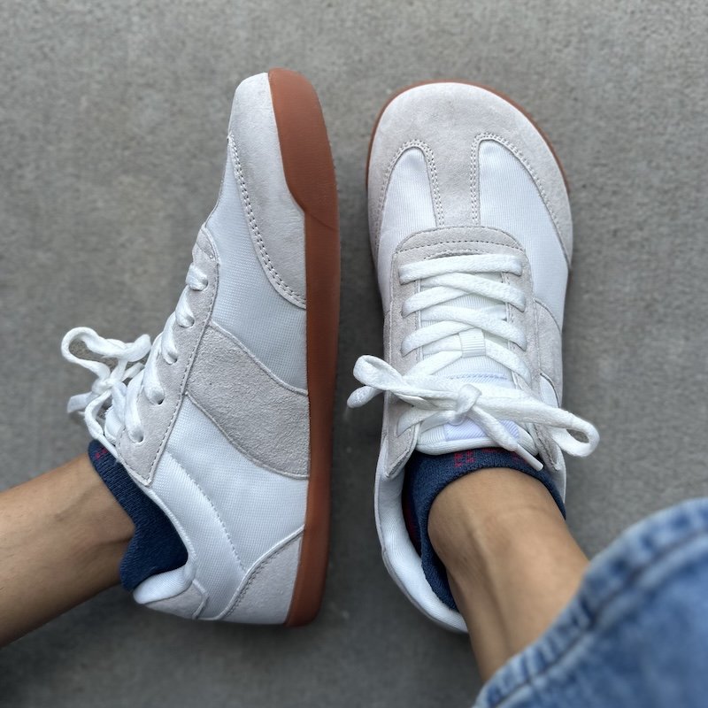 A top down and side profile view of a pair of Whitin affordable barefoot shoe from Amazon with a zero drop sole and a wide toe box