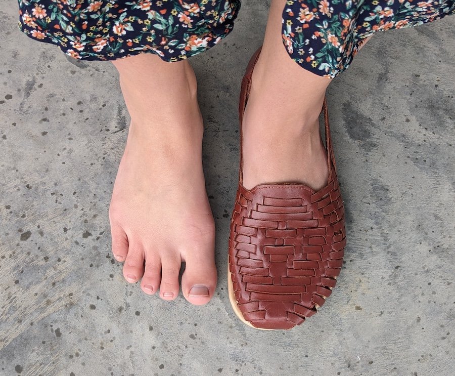 Top down view of a person with extra wide feet wearing Origo Wide Huarache by Anya to show that it has a wide toe box and natural fit