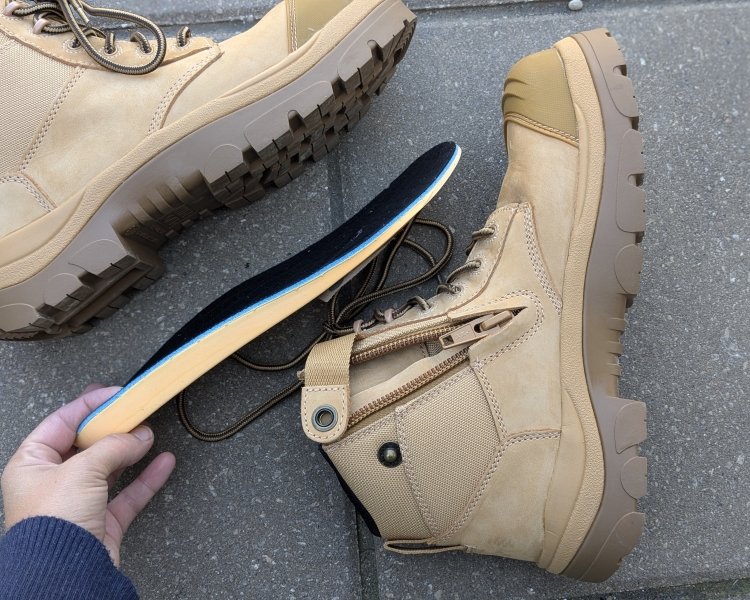 A pair of Wide Load extra wide work boots with safety toe, showing the small heel and cushioned insole