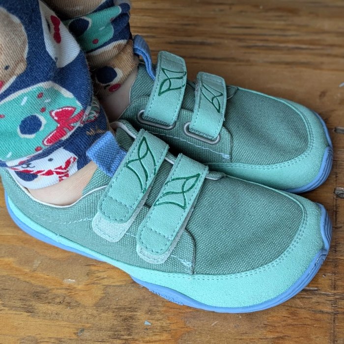 Wildling Lago spring 2025 barefoot shoes for kids with velcro straps in a fresh green material with a periwinkle blue sole