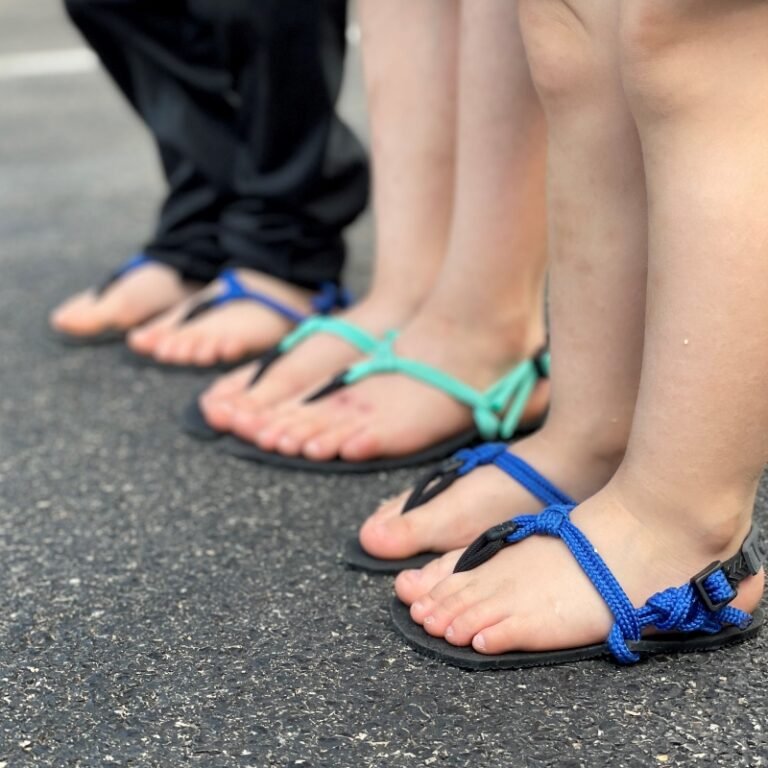 3 Kids lined up wearing Xero DIY sandals - an affordable alternative to flip flops