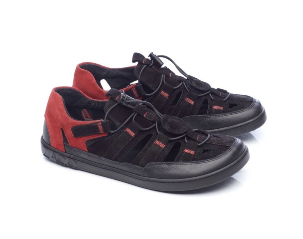 A close up product photo of a pair of black and red Zaqq Qerry water hiking sandals with a white background