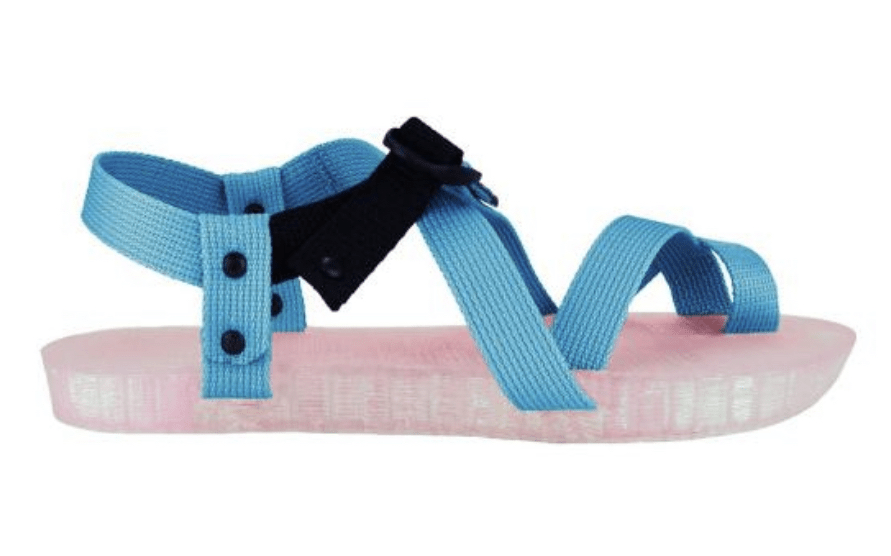A thick-soled sandal with bright blue straps and a pink sole against a white background