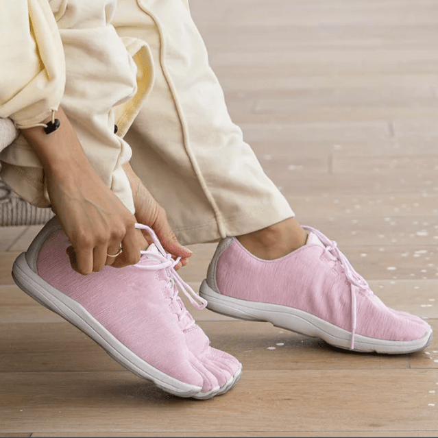 A pair of pink toe pocket sneakers from Peluva with a moderate thickness zero drop outsole for barefoot feeling