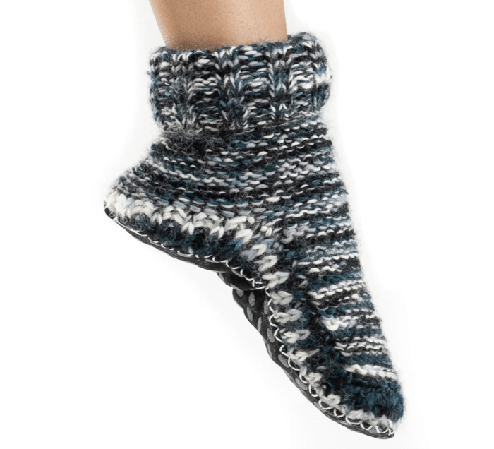 a single foot wearing Tibetan slipper socks