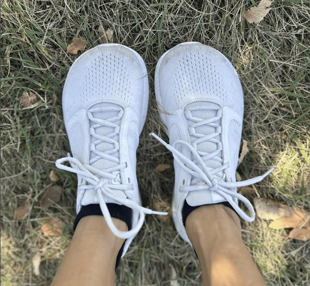 Top down view of wide toe box Topo Athletics white sneakers with a zero drop sole